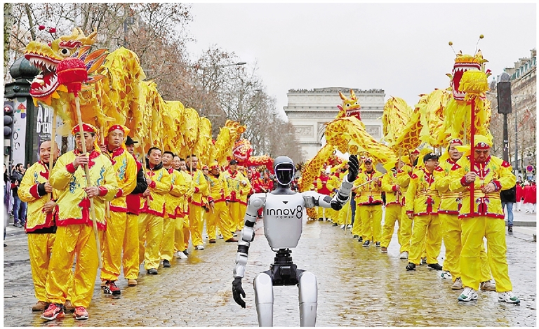 2月1日,在法国首都巴黎的香榭丽舍大街,由宇树科技及其法国代理INNOV8集团提供的机器人参加巡游活动。 新华社记者 张百慧 摄
